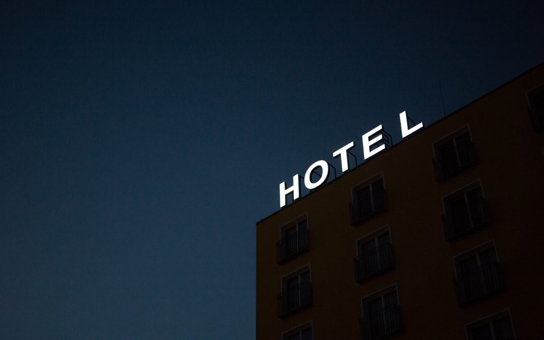 hotel sign at the top of the building at night